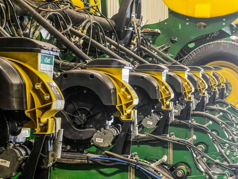 A row of vSet meters mounted across a planter toolbar
