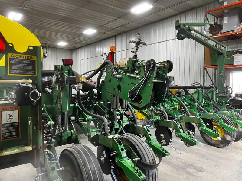 Green planter with yellow tanks inside the Flat Rock Precision shop