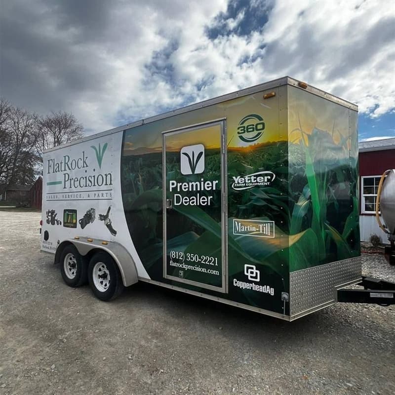 Flat Rock Precision service trailer parked under a cloudy sky