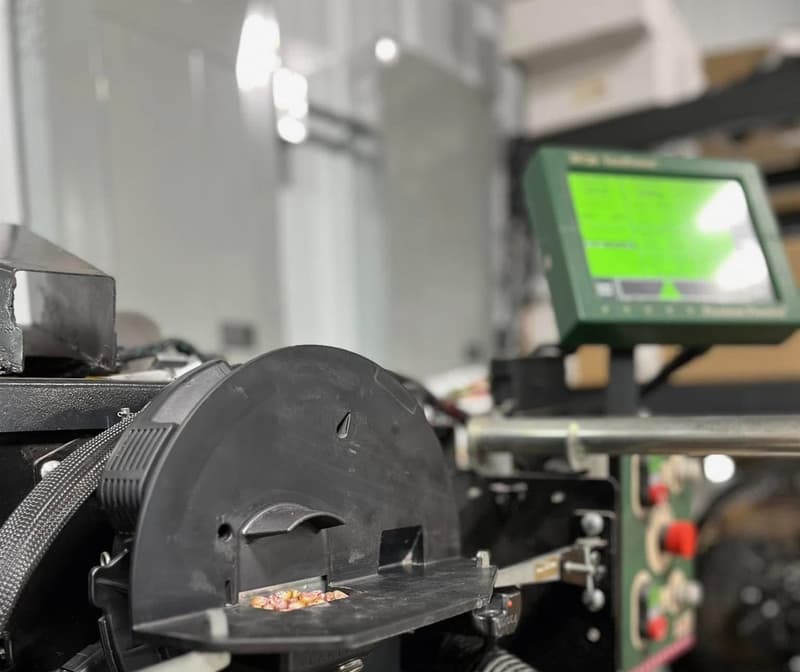 Meter mounted on the MeterMax test stand with its screen lit